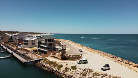 top view drone flying over coastline neighborhood near an harbour