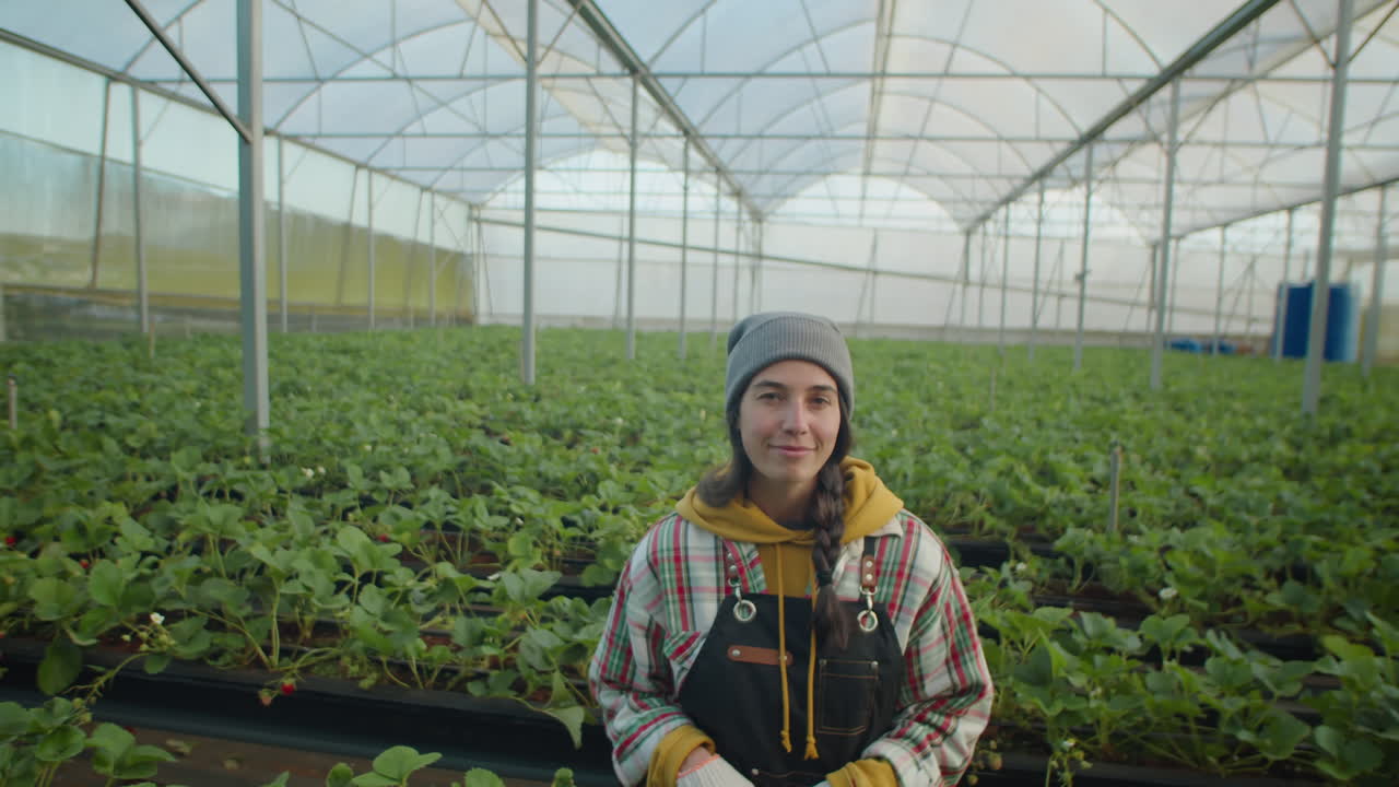 Portrait of Young Woman in Strawberry Greenhouse Farm