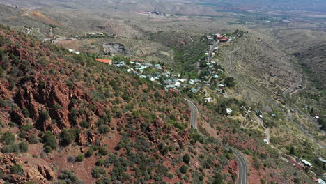 aerial view of jerome, old copper mining town in arizona, usa, verde valley and landscape on sunny day, drone shot