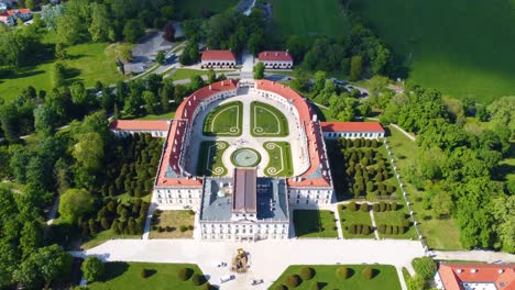 aerial shot of esterhazy palace located in fertod, hungary with breathtaking gardens on a warm, sunny day near sunset