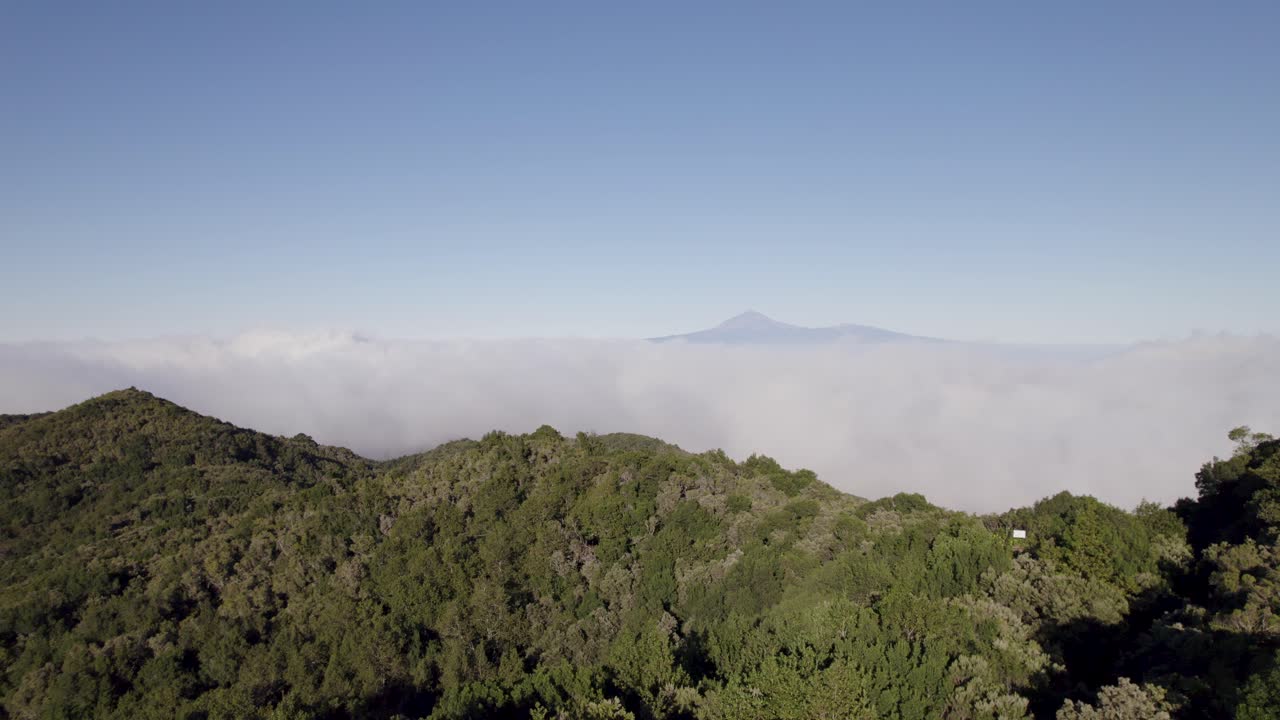 Rising drone footage with a distant view of El Teide from Alto de Garajonay on the island of La Gomera