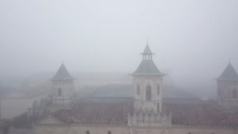 facade of chateau cos d'estournel winery shrouded in fog, bordeaux in france