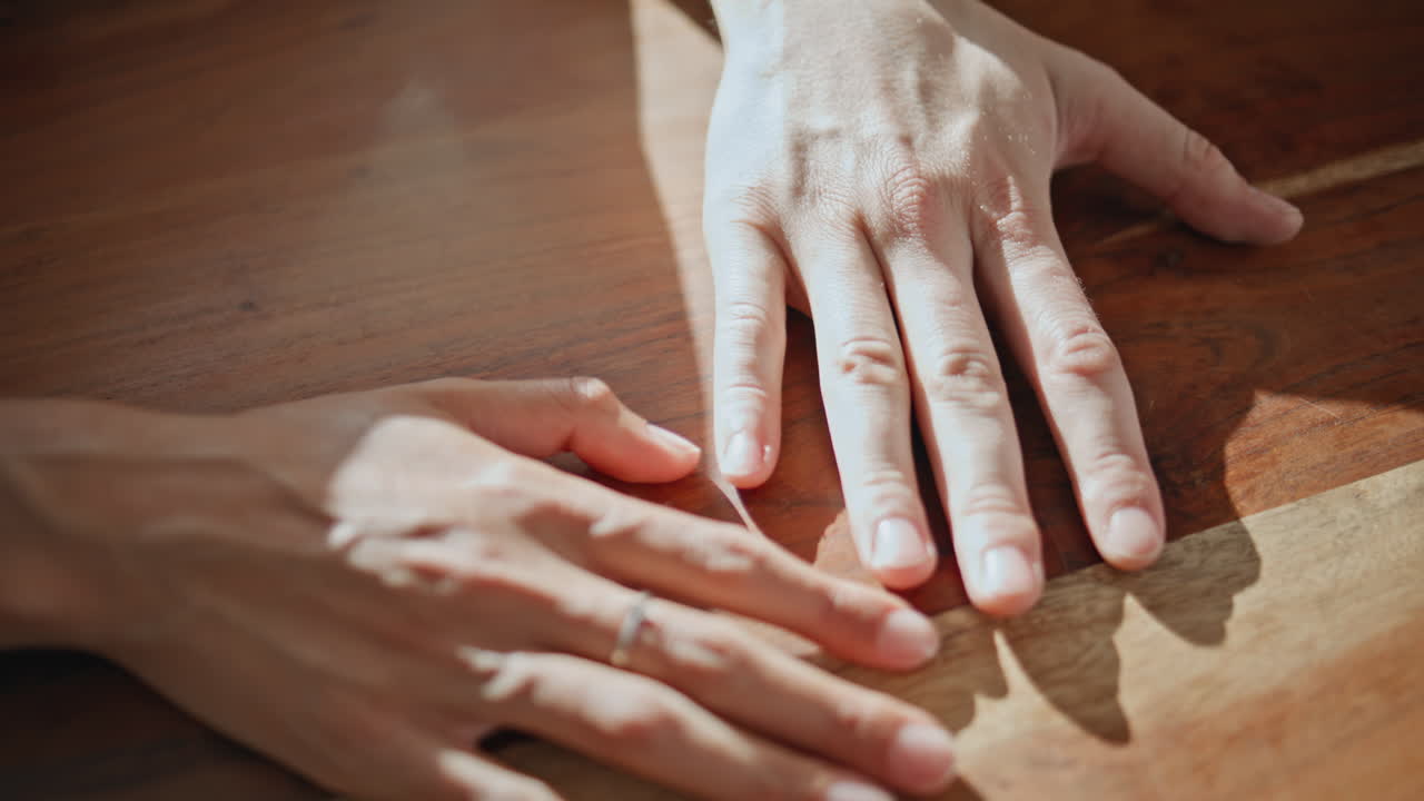 Closeup sweethearts arms touching in sunlight. Affectionate people express love