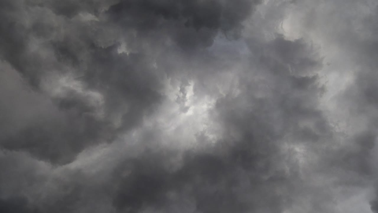 gray clouds and Storm over the dark sky