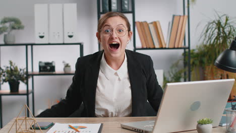 happy amazed businesswoman shocked by sudden victory game winning lottery goal achievemen, good news