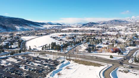 view of the cars driving around steamboat springs ski resort in colorado during wintertime