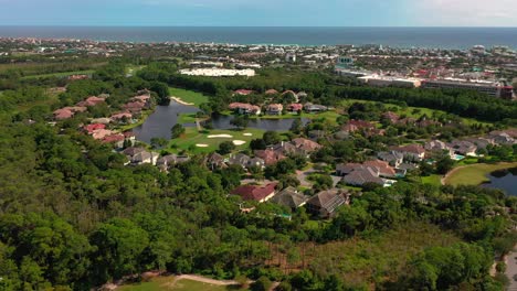 drone rising view of regatta bay golf and yacht club in destin florida