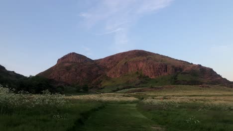 Arthur&#039;s Seat bathed in golden light, unveils an ethereal and enchanting scene that captivates with its resplendent and transcendent beauty
