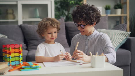 mother and child drawing together