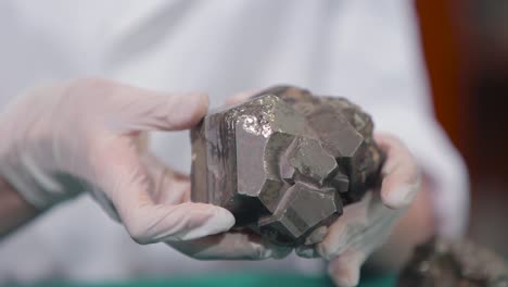 pyrite crystal displayed in hands