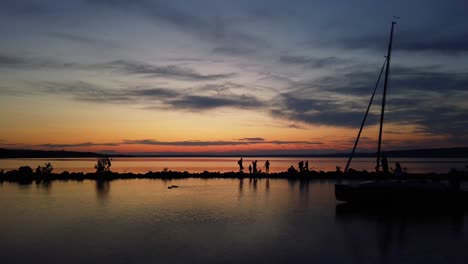 boat going through at lake balaton in the sunset