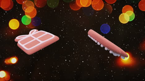 animation of christmas gingerbread cookies over snow falling and christmas fairy lights