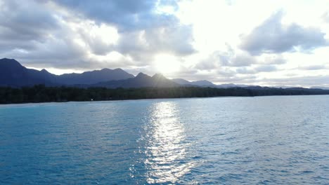 sunset dropping behind the mountains of oahu