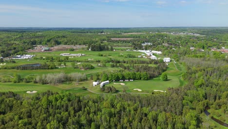 tpc toronto osprey valley golf course on sunny day, wide drone shot