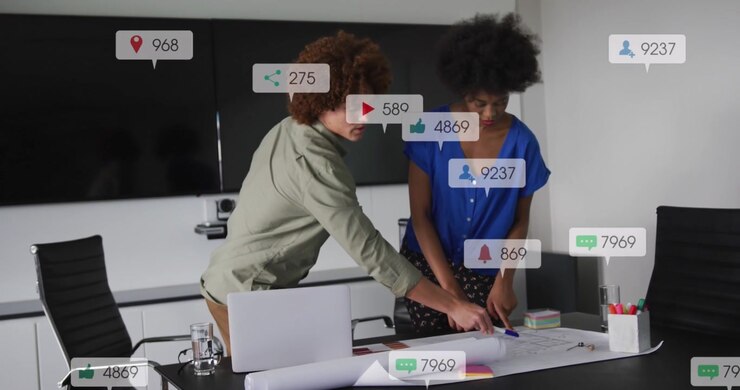 Colleagues Collaborating on Project with Social Media Analytics Overlay