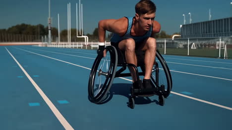 athlete in wheelchair racing on track