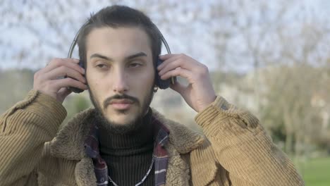 young man wearing onear headphones