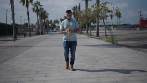 man reading a book outdoors