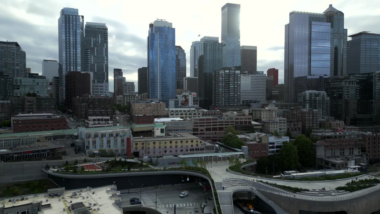 Panoramic view of dense cityscape and skyline along Elliot Way, Seattle, Washington - aerial drone shot