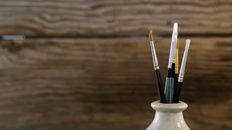 various paintbrush in vase