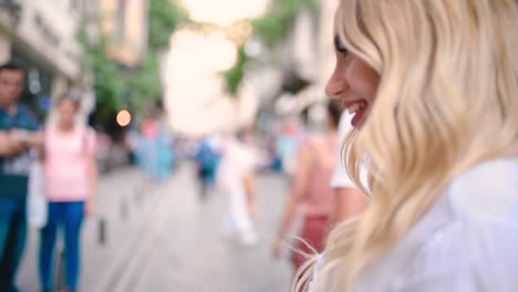 Slow,motion:Attractive-young-beautiful-girl-waves-Turkish-flag-and-pulls-arm-of-her-boyfriend-at-narrow-street-in-Istanbul,Turkey