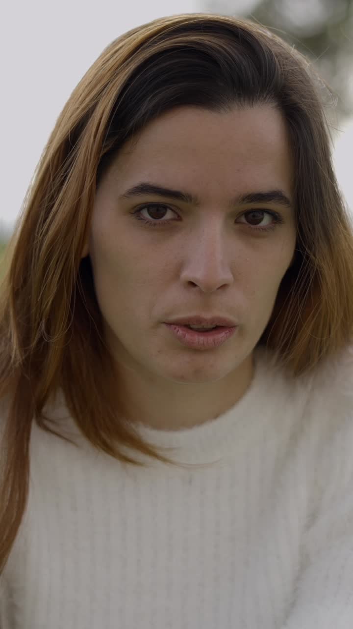 Close-up portraits of a woman with varying facial expressions
