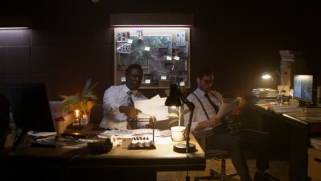 detectives analyzing evidence at a crime scene