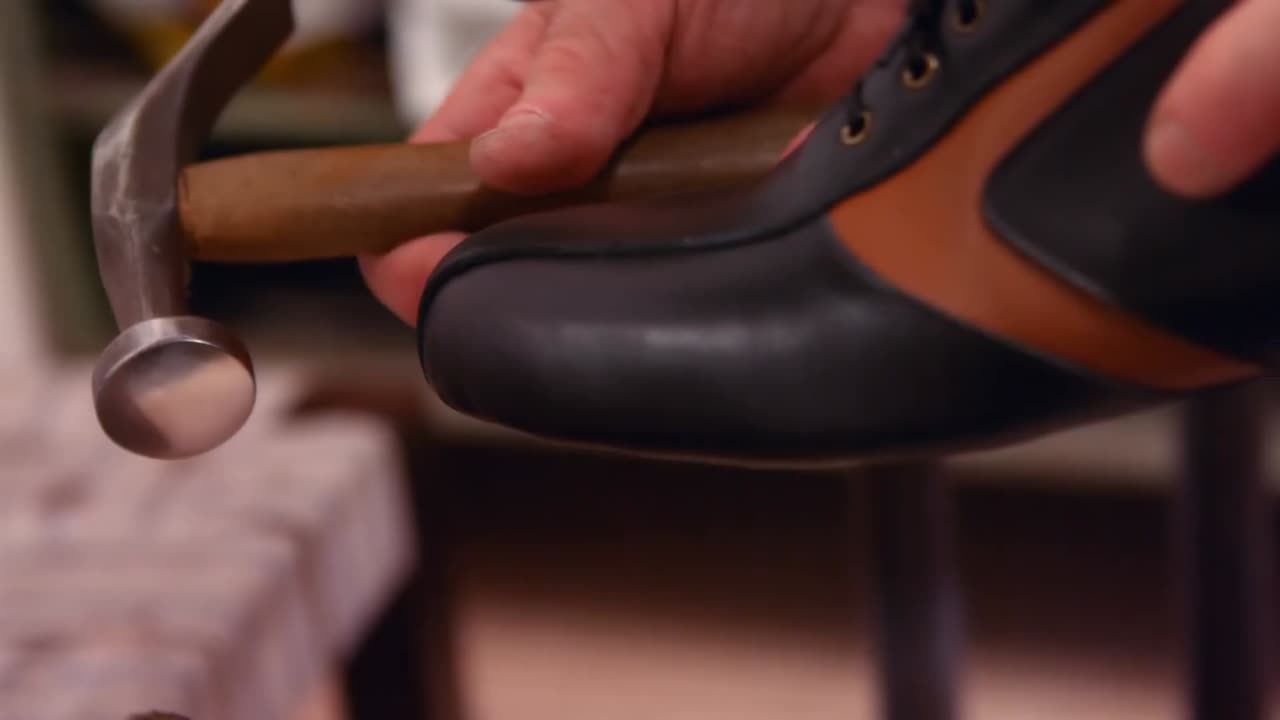 Cobbler hammering on a shoe