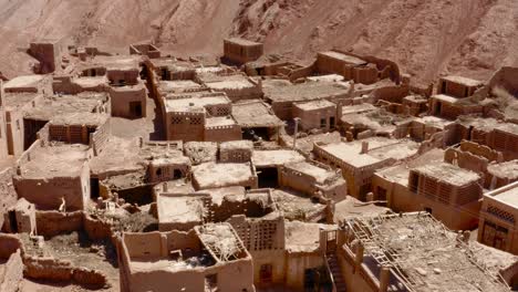 Overview-of-Tuyoq-Xinjiang,-Tuyuk-aerial-of-oasis-village-in-the-Taklamakan-desert,-Flaming-Mountains,-Xinjiang-Uighur,-Region-of-China