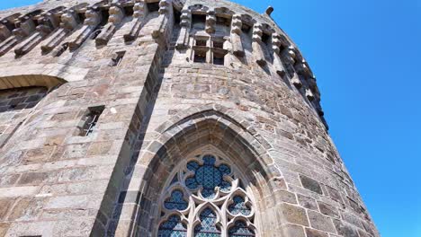 close-up view with smooth tilt movement from the dinan castle facade details, dinan, france