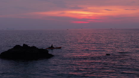sunset kayaking on rocky coast