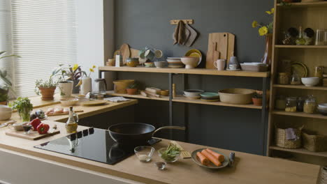 modern minimalist kitchen: cooking vegetables