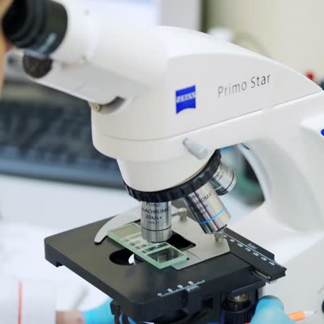 female doctor with microscope