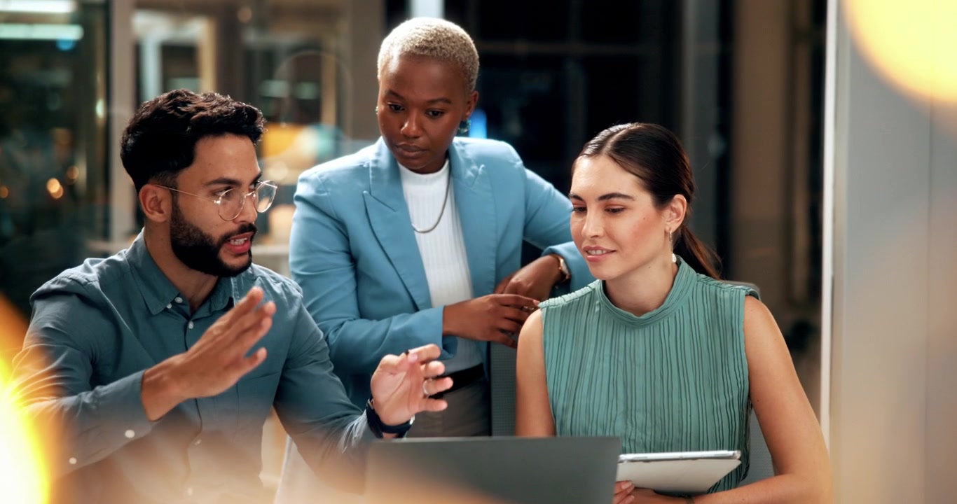 Diverse Business Team Collaborating on a Project in Modern Office