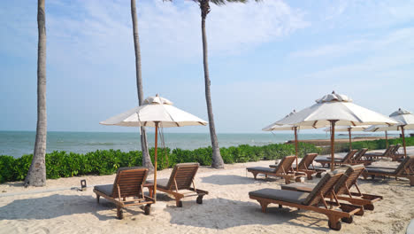 umbrella-with-beach-chair-and-ocean-sea-background---holiday-and-vacation-concept