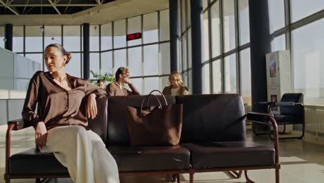 woman waiting in airport lounge