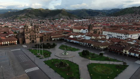 Daytime-4k-aerial-footage-of-Plaza-de-Armas-in-Cusco-City,-Peru-during-Coronavirus-quarantine,-left-to-right-truck-and-pan,-wide-angle-shot