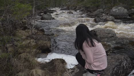 Girl-finds-something-in-the-river