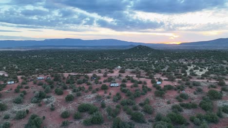 Aerial-View-Of-Camper-Vans-In-The-Campsite-Covered-With-Green-Bushes-Near-Sedona,-Arizona