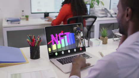 video of african american man having nft video call on laptop with coworkers