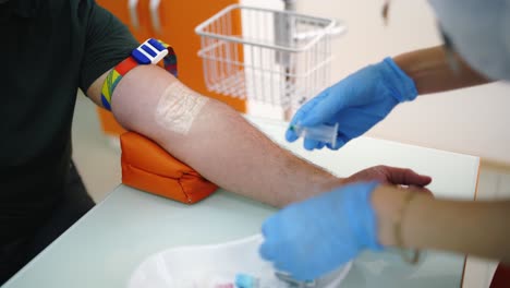 Close up process of taking blood. Process of blood sampling from the vein for examination