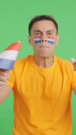 man cheering for holland, angry with the decision of referee