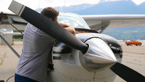 engineer servicing aircraft engine 4k