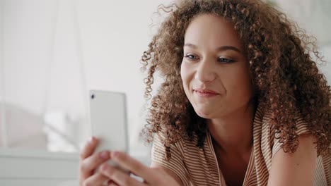 smiling young woman on the phone