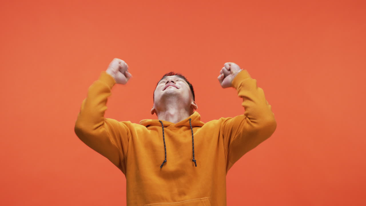 Happy Man in Orange Hoodie
