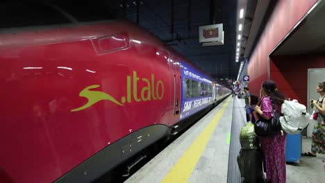 passengers boarding italo train in turin, italy