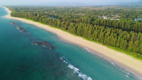 Stunning-Natai-Beach-in-Phang-Nga-Thailand-Aerial-Drone,-Native-Pine-Trees-along-the-Andaman-Coast