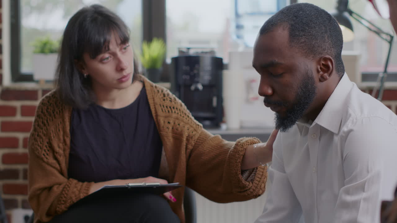 Close up of african american man complaining about mental health issues at aa meeting