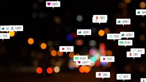 animation of social media icons and numbers over out of focus city and car lights