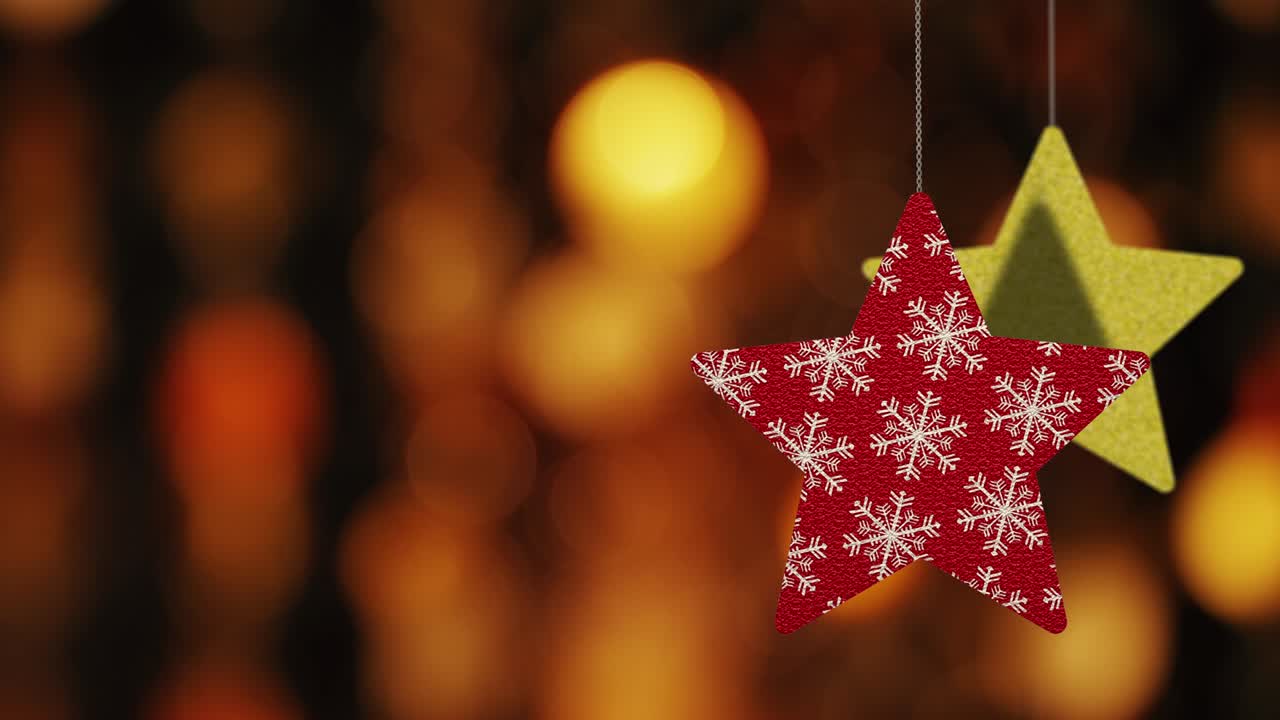los adornos de las estrellas de navidad se mueven en el fondo de bokeh.